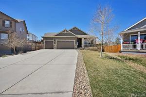 a house with a driveway in front of a house at 4BR Home close to Airport in Aurora