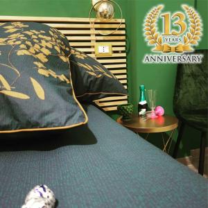 a bedroom with a bed with a pillow and a table at B&B Castelluccio in Villafranca Tirrena