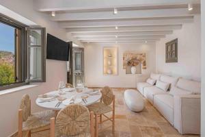 a living room with a table and a couch at Casa Alizeta in Halki