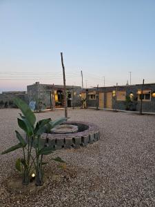 a courtyard with a bench in front of a building at Lily's motel in El Alamein