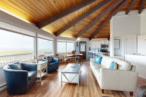 a living room with a couch and a table at The Octagon on the Beach in Seaside