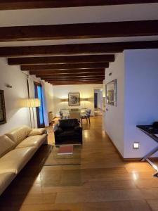 a living room with a couch and a table at Cathedral Exclusive Flat - Palma in Palma de Mallorca +6 photos