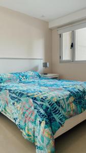 A bed or beds in a room at TERRAZAS DE QUEQUEN