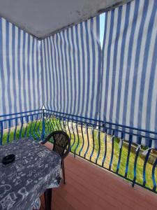 a table and a bench in a yurt at Barcelona Apartments in Tivat