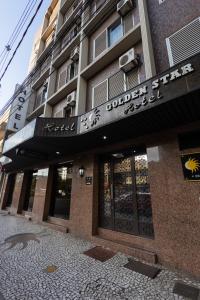 a building with a sign on the front of it at Hotel Golden Star in Curitiba +138 photos