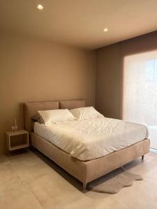 Postel nebo postele na pokoji v ubytování golden suites 2