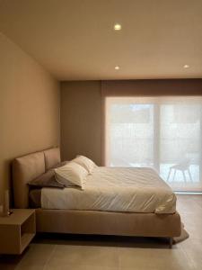 Postel nebo postele na pokoji v ubytování golden suites 2