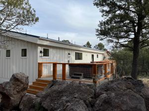 a house under construction with a deck at Thunder Hollow in Ruidoso