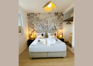 Ένα ή περισσότερα κρεβάτια σε δωμάτιο στο Special Apartment - stadtnah, Balkon, Parkplatz, E-Ladestation, Gitterbox für Fahrräder, Fitnessstudio