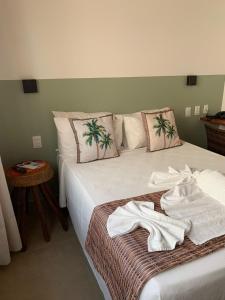 En eller flere senge i et værelse på Villa Peixe Na Telha
