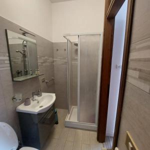 a bathroom with a shower and a sink and a toilet at La Malva in Ostia Antica