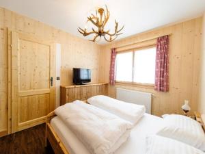 A bed or beds in a room at Ferienpark Gaal