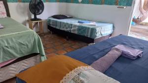 Postel nebo postele na pokoji v ubytování POUSADA ATINS MELo