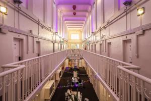 a hallway of a building with christmas lights at Jailhouse Accommodation in Christchurch