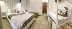 Posteľ alebo postele v izbe v ubytovaní Monti49 GuestHouse
