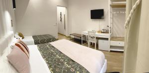 Posteľ alebo postele v izbe v ubytovaní Monti49 GuestHouse