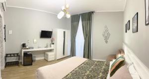 Televízia a/alebo spoločenská miestnosť v ubytovaní Monti49 GuestHouse