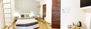 Posteľ alebo postele v izbe v ubytovaní Monti49 GuestHouse