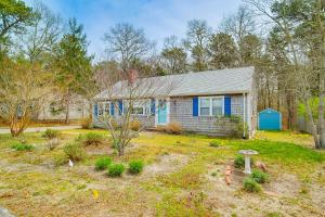 a house with a blue door and a yard at South Dennis Vacation Rental about 5 Mi to Beach! in South Dennis