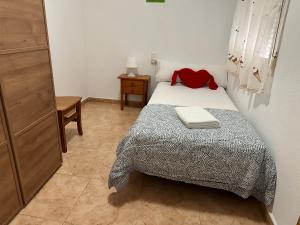 Łóżko lub łóżka w pokoju w obiekcie Homely Apartments Alcatri