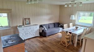 a living room with a couch and a table at Plagandõ puhkemaja in Leimani
