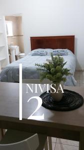 Edificio NIVISA客房内的一张或多张床位