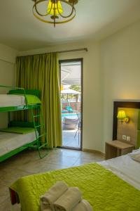 a bedroom with two bunk beds and a balcony at Sea Pearl Luxury Apartments in Nea Vrasna +98 photos