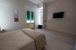 TV a/nebo společenská místnost v ubytování TERESITA Guest House