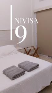 Edificio NIVISA客房内的一张或多张床位