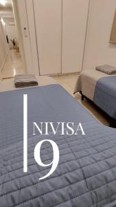 Edificio NIVISA客房内的一张或多张床位