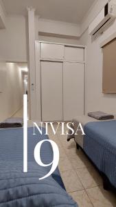 Edificio NIVISA客房内的一张或多张床位