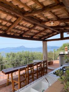 a kitchen with a table and chairs on a patio at B&B Calandrella in Maratea