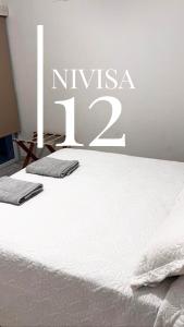 Edificio NIVISA客房内的一张或多张床位