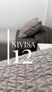 Edificio NIVISA客房内的一张或多张床位