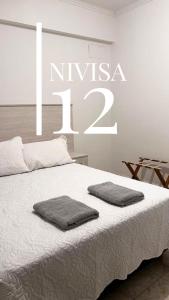 Edificio NIVISA客房内的一张或多张床位