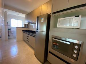 Dapur atau dapur kecil di Condomínio Edifício Viena