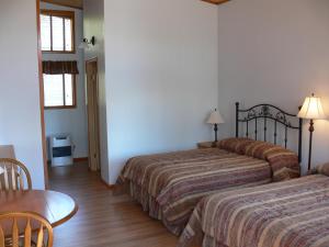 Cama o camas de una habitación en Dalton Trail Lodge