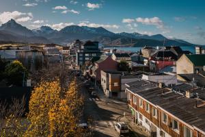 a view of a city with mountains in the background at Gente del Sur - Urbano Centro in Ushuaia