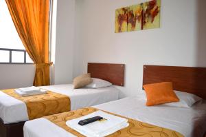 Postel nebo postele na pokoji v ubytování Hotel Tropico Real Mesitas