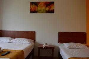 Postel nebo postele na pokoji v ubytování Hotel Tropico Real Mesitas