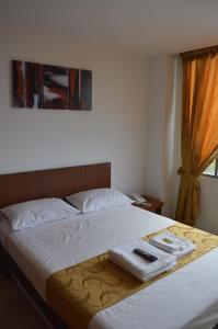 Postel nebo postele na pokoji v ubytování Hotel Tropico Real Mesitas