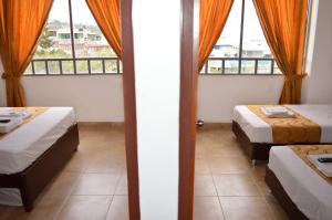 Postel nebo postele na pokoji v ubytování Hotel Tropico Real Mesitas