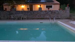 a swimming pool in front of a house at seaside suite in paradise in Santuario di Gibilmanna