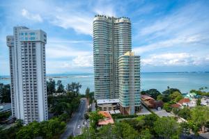 two tall buildings in a city next to the water at Georgetown Seaview MansionOne @Penang in George Town