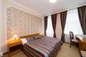 Posteľ alebo postele v izbe v ubytovaní Hotel Saint Petersburg