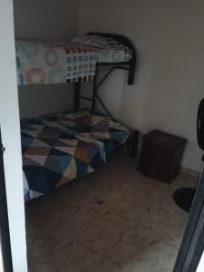 a bedroom with a bunk bed in a room at casa turística La Alameda in Carmen de Apicalá +4 photos