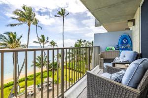 a balcony with a view of the beach at NEW Beachfront Condo & Amazing Views in Hauula