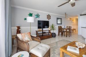 a living room with a couch and a table at NEW Beachfront Condo & Amazing Views in Hauula
