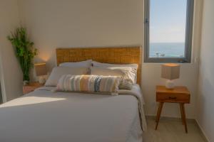 Ένα ή περισσότερα κρεβάτια σε δωμάτιο στο Luxury, Ocean View, Pool, Jacuzzi, Valle de Guadalupe, Los Portales De Garcia, Splash, Encanto Restaurants, Surf Breaks in Primo Tapia, Rosarito