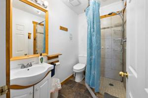 a bathroom with a shower and a sink and a toilet at Happy Daze Big Space Near Village Lots of fun Hot Tub in Blue Mountains +61 photos